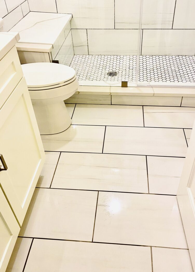 Oak Crest — completed tile floor and toilet in the renovated bathroom