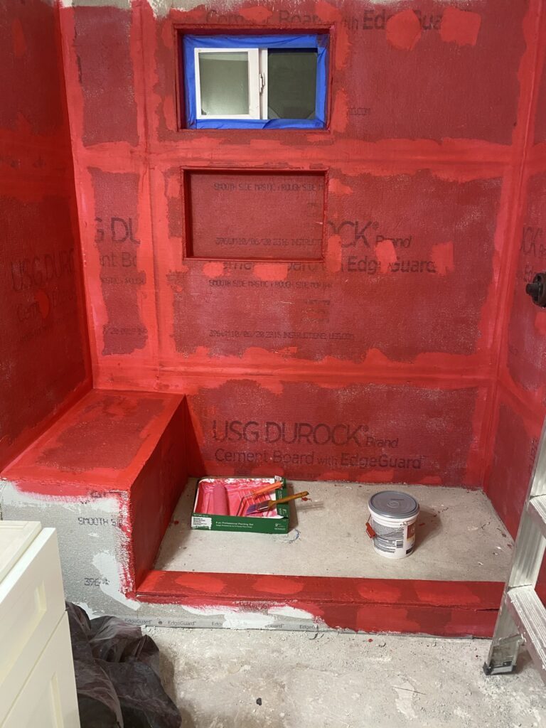 Oak Crest — wall tile being set in the new shower